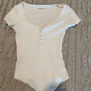 Chic White Ribbed Bodysuit with Button Detail